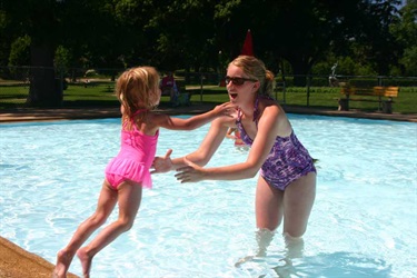Mom in the pool with daughter