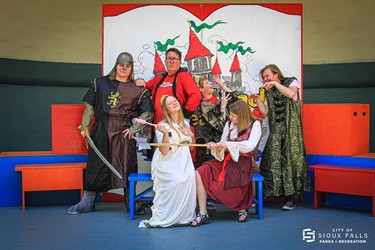 actors in costume on stage