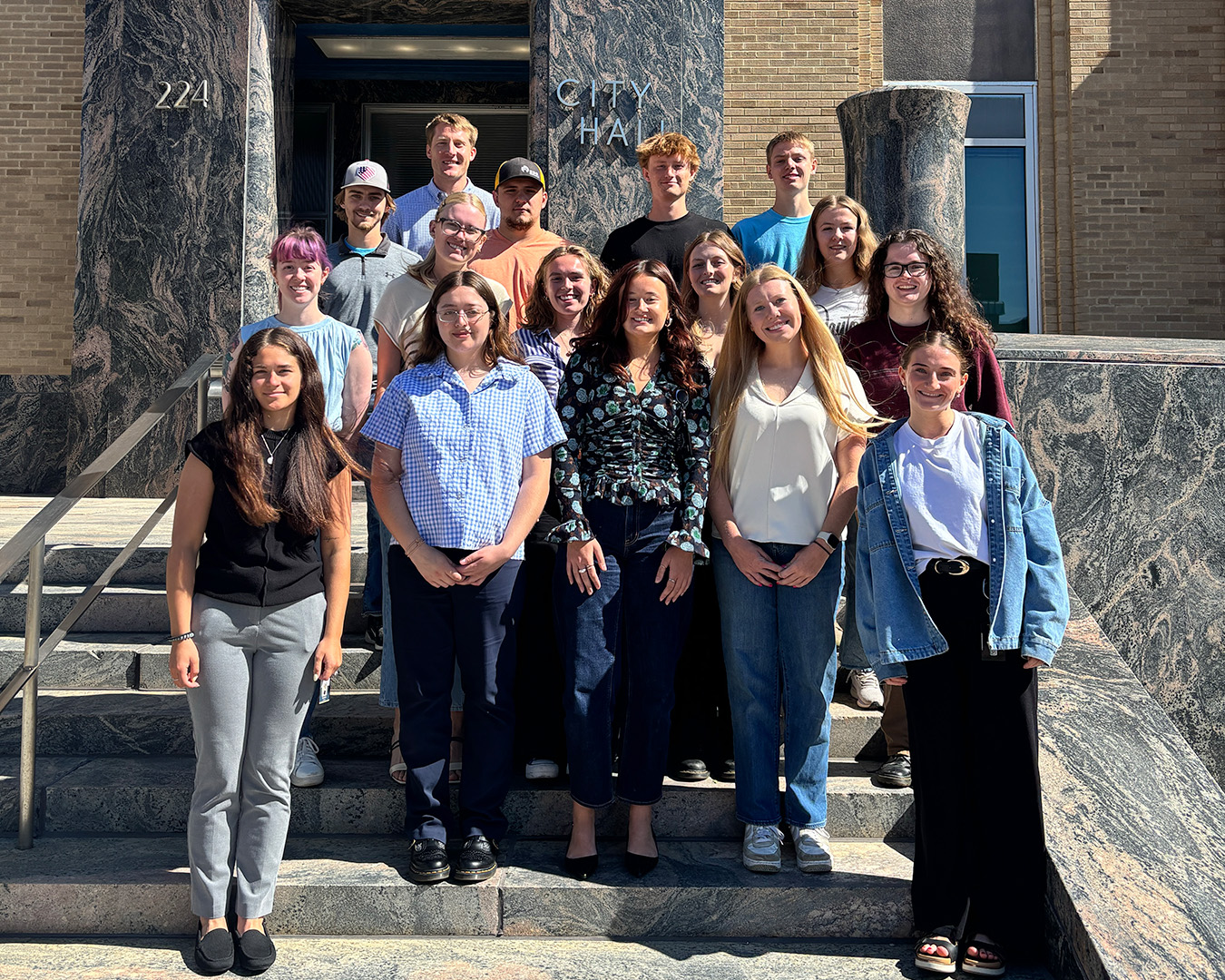 a group of students standing in front of City Hall taking part in the Ascend Internship program