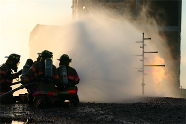 Firefighter putting out a fire