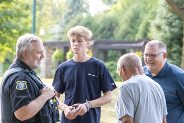 Police officer with community members