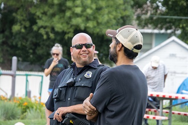 police officer talking with citizens