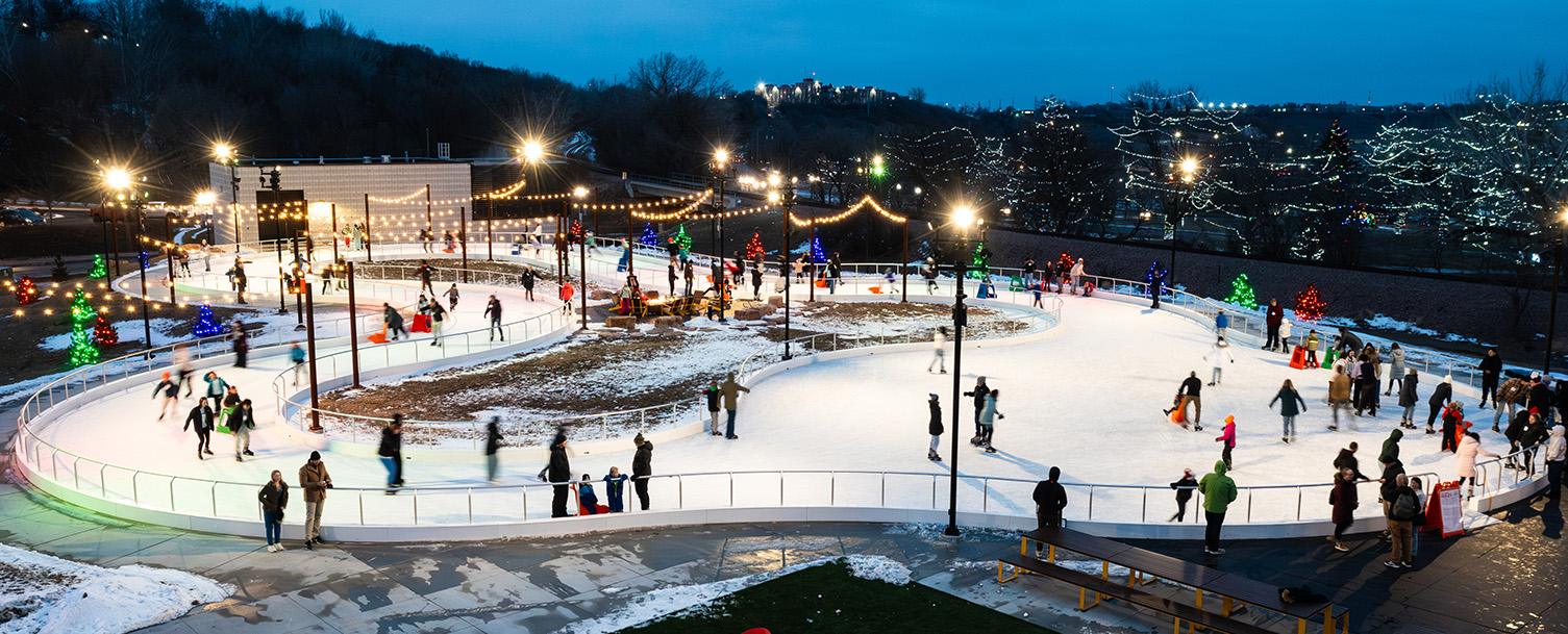 people skating at night at the Jacobson ice ribbon