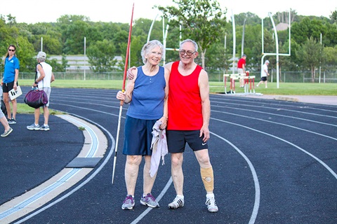 Two senior citizens on a track participating in the Senior games