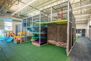 The rock climbing wall on the multilevel play structure