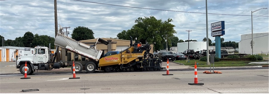 Asphalt truck dumping