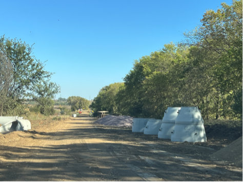 Looking east along 72nd Street with storm drainage culverts on the left hand side 