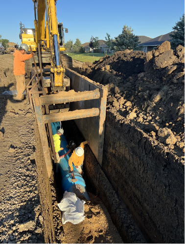 Contractor installing watermain along 12th Street. 