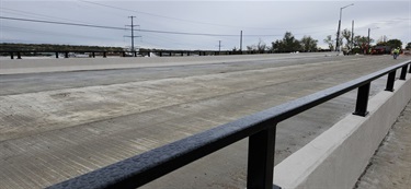 Repaired painted bridge railing