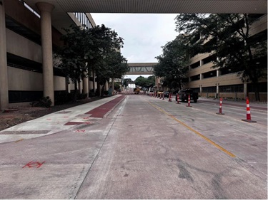 looking west at new pavement and sidewalk
