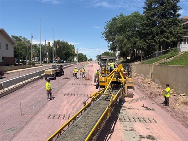 Looking north on Minnesota Ave at new concrete getting layed out