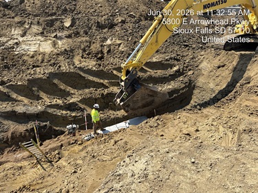 Men installing a new storm sewer