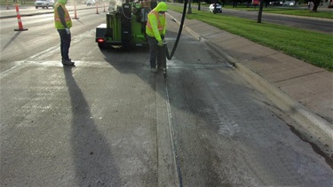 Crews resealing concrete joints