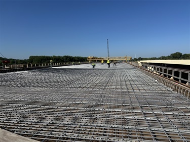 Crew laying rebard down in preparation of new concrete on the bridge