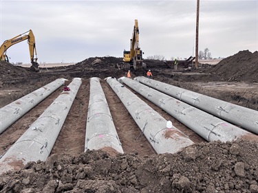 an image of concrete sewer culverts being prepared