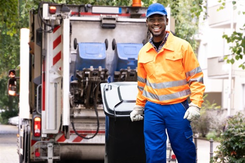 Garbage man in orange and blue