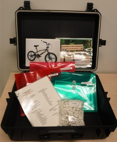 black case open with educational materials laid out