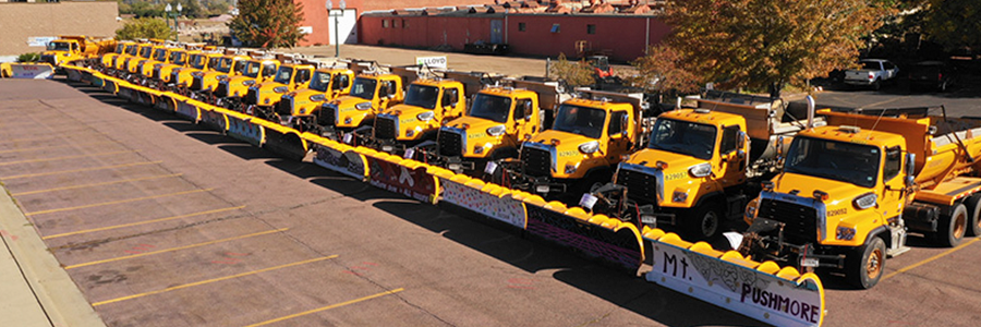 Line of snow plows