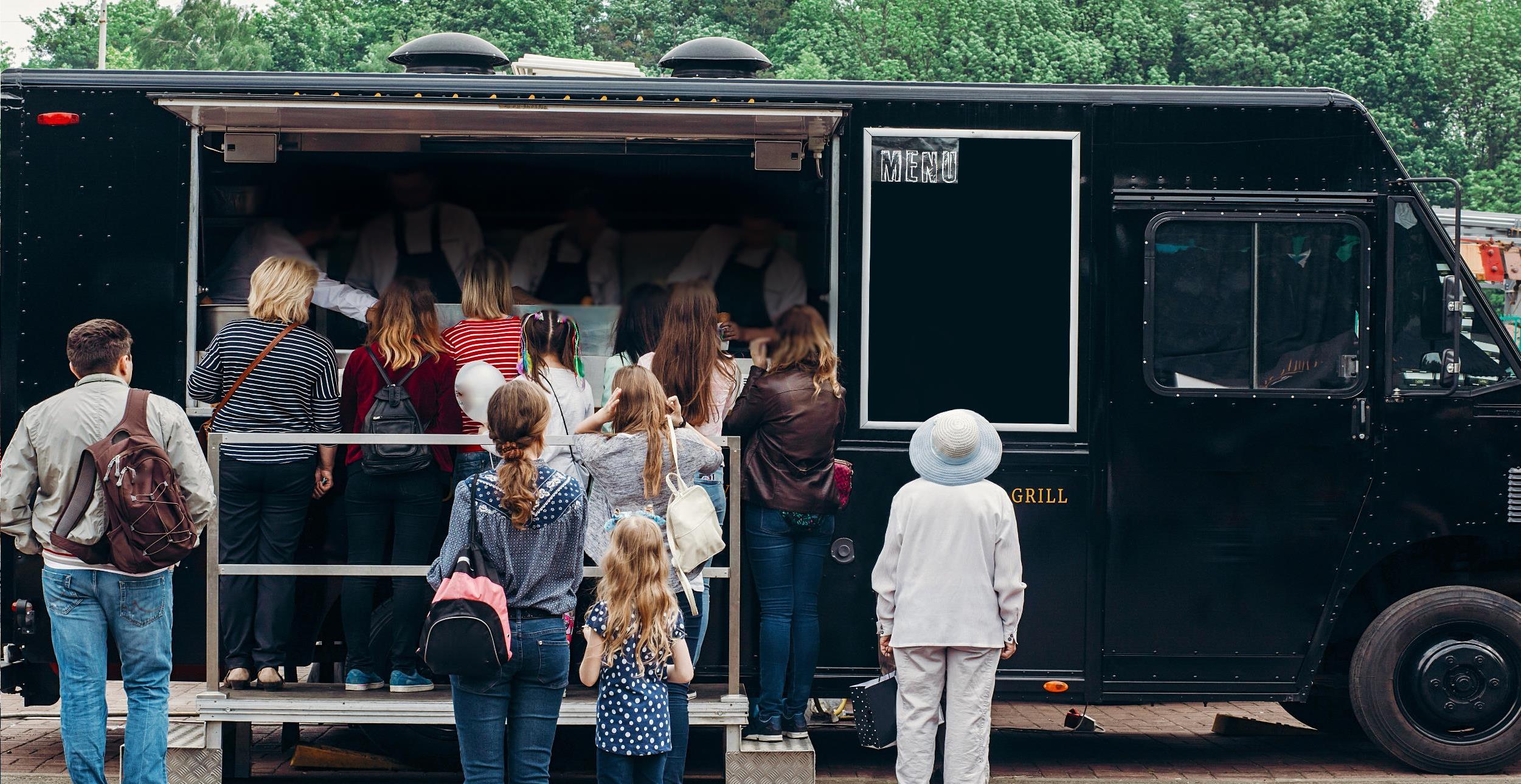 image of people standing at a food truck
